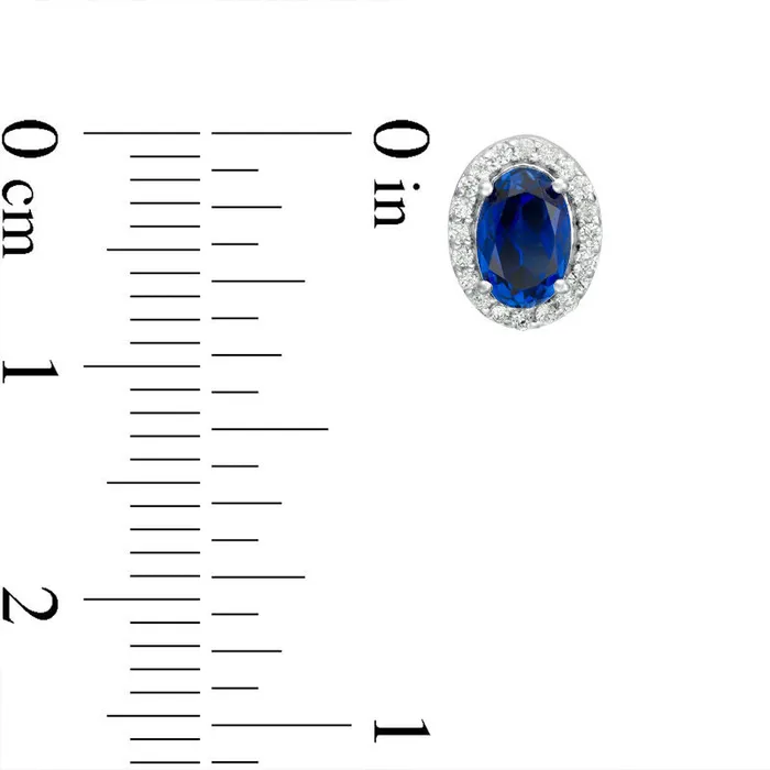 Goldia Earrings Oval LabCreated Blue Sapphire and 013 CT TW Diamond Frame Stud Earrings in 10K White Gold Goldia Earrings Oval LabCreated Blue Sapphire and 013 CT TW Diamond Frame Stud Earrings in 10K White Gold