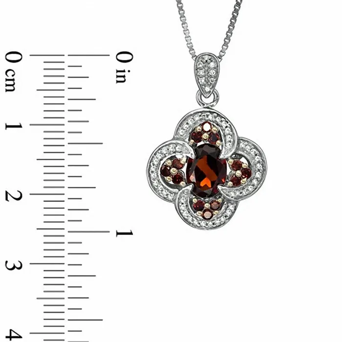 Necklaces Goldia Oval Garnet and 033 CT TW Enhanced Red and White Natural Diamond Pendant in Sterling Silver Necklaces Goldia Oval Garnet and 033 CT TW Enhanced Red and White Natural Diamond Pendant in Sterling Silver