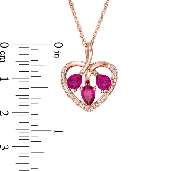 Necklaces PearShaped LabCreated Ruby and White Sapphire Three Stone Heart Pendant in Sterling Silver with 14K Rose Gold Goldia Necklaces PearShaped LabCreated Ruby and White Sapphire Three Stone Heart Pendant in Sterling Silver with 14K Rose Gold Goldia